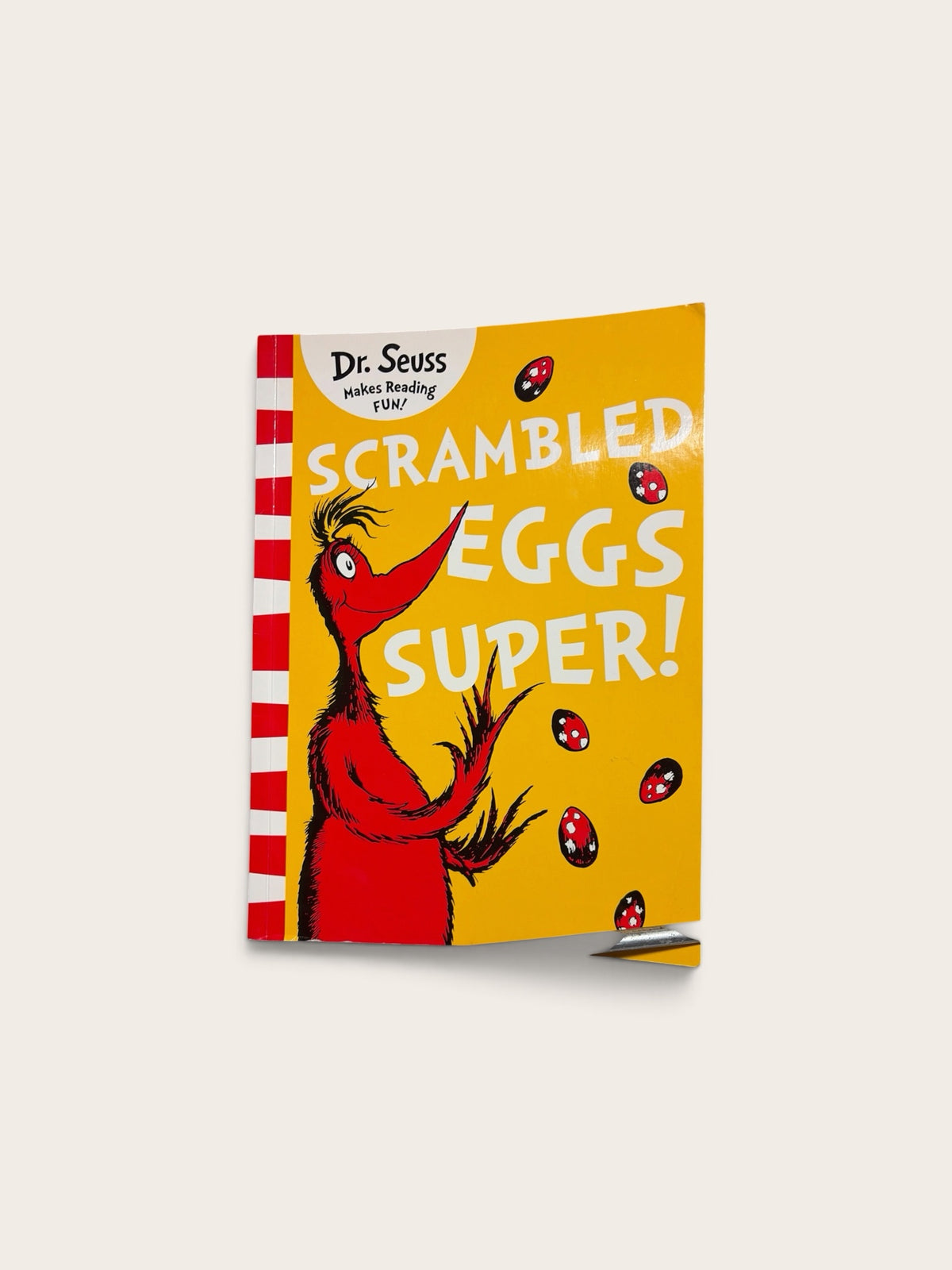 Cuse Treasures Dr. Seuss Scrambled Eggs Super children's book with a vibrant yellow cover and red creature illustration.